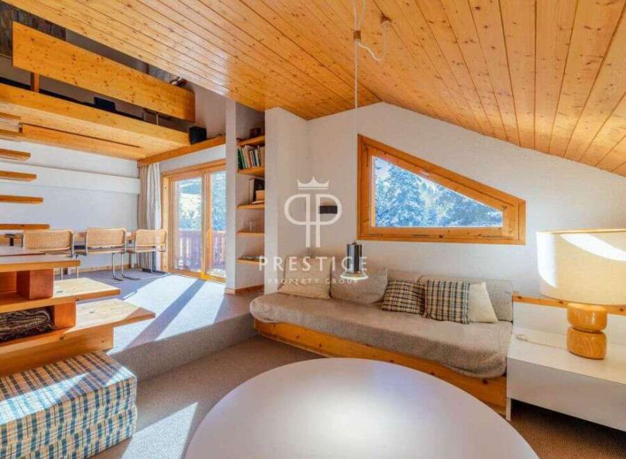 Discover the charm of this stunning property, featuring a unique architectural design with exposed wooden beams and a cozy, inviting atmosphere.