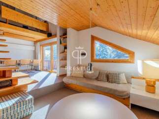 Discover the charm of this stunning property, featuring a unique architectural design with exposed wooden beams and a cozy, inviting atmosphere.