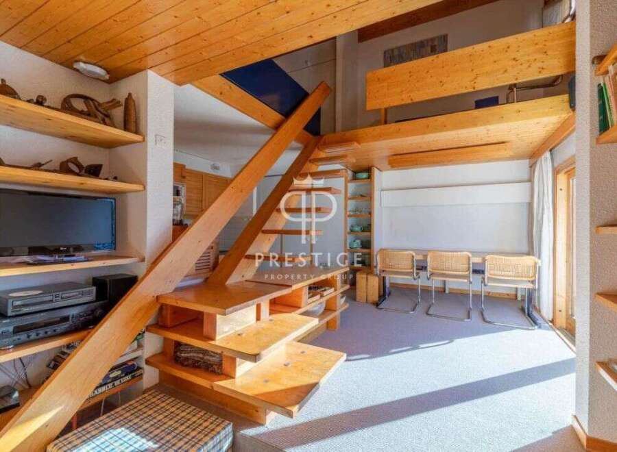Discover a unique property with stunning wooden architecture and a cozy interior.