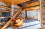 Discover a unique property with stunning wooden architecture and a cozy interior.