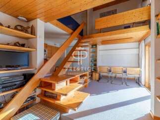 Discover a unique property with stunning wooden architecture and a cozy interior.