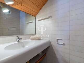 Discover a stylish bathroom with a modern sink and elegant fixtures.