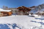 Discover a stunning chalet nestled in a winter wonderland.