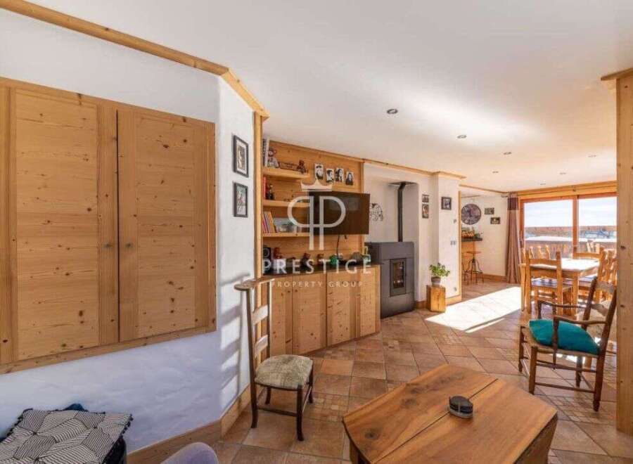 Discover the charm of this stunning property, featuring exquisite wooden accents and a cozy fireplace.