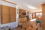Discover the charm of this stunning property, featuring exquisite wooden accents and a cozy fireplace.