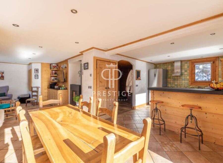 Discover the charm of this stunning property, featuring a spacious dining area perfect for gatherings.
