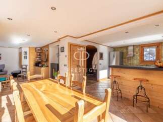 Discover the charm of this stunning property, featuring a spacious dining area perfect for gatherings.