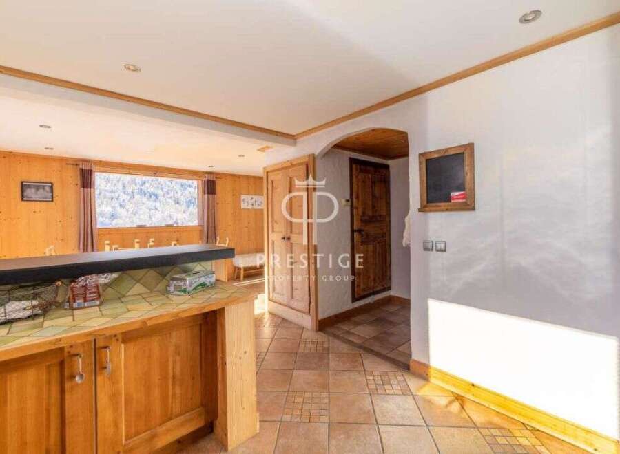 Discover a charming property with a rustic interior, featuring wooden accents and a cozy atmosphere.
