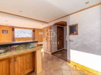 Discover a charming property with a rustic interior, featuring wooden accents and a cozy atmosphere.