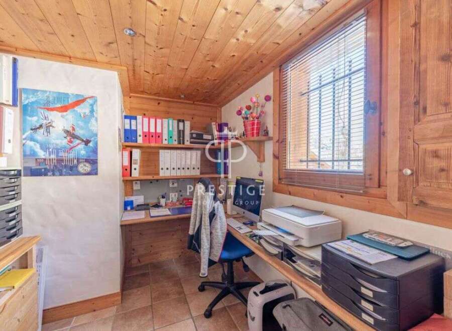 Discover a cozy home office with charming wooden accents.