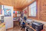 Discover a cozy home office with charming wooden accents.