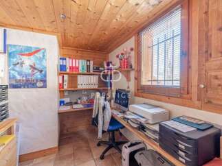 Discover a cozy home office with charming wooden accents.