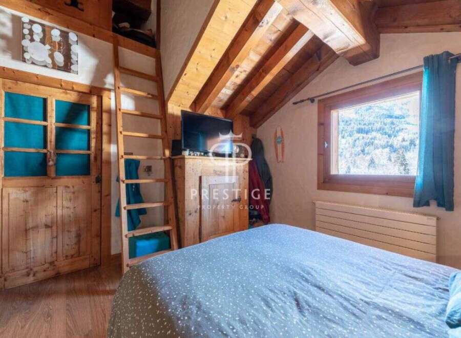 Discover the charm of this cozy mountain retreat, featuring rustic wooden accents and a warm, inviting atmosphere.