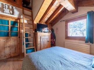 Discover the charm of this cozy mountain retreat, featuring rustic wooden accents and a warm, inviting atmosphere.