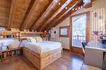 Discover a charming bedroom with a rustic wooden design.