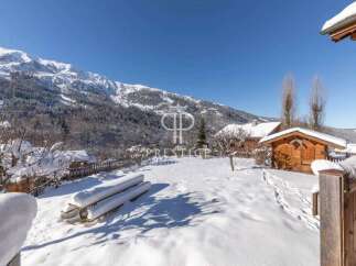 Experience the ultimate winter escape in this stunning property nestled amidst a snowy landscape.