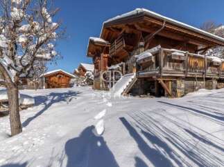 Discover a stunning chalet nestled in a winter wonderland.