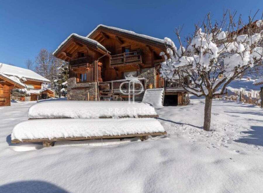 Experience the charm of a snow-covered chalet nestled in a picturesque winter wonderland.