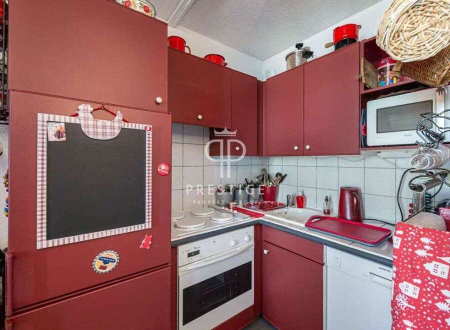 Cozy kitchen with a charming, rustic design.
