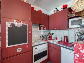 Cozy kitchen with a charming, rustic design.