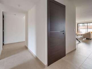 This stunning property boasts a sleek, modern design with high-end finishes throughout.