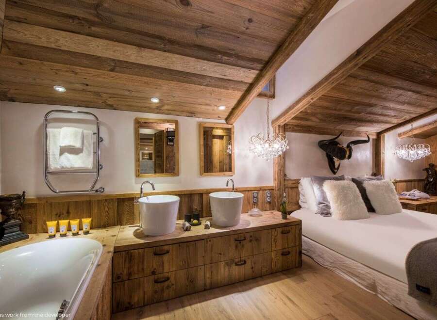 Experience rustic luxury in this stunning bathroom and bedroom.