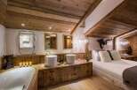 Experience rustic luxury in this stunning bathroom and bedroom.
