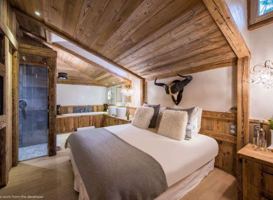 Experience rustic luxury in this stunning bedroom.