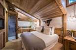 Experience rustic luxury in this stunning bedroom.
