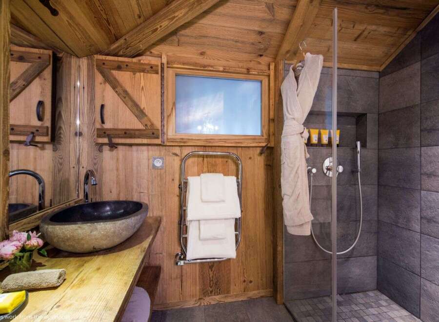 Experience rustic luxury in this stunning bathroom.