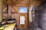 Experience rustic luxury in this stunning bathroom.