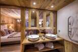 Experience rustic luxury in this stunning chalet-style bathroom.