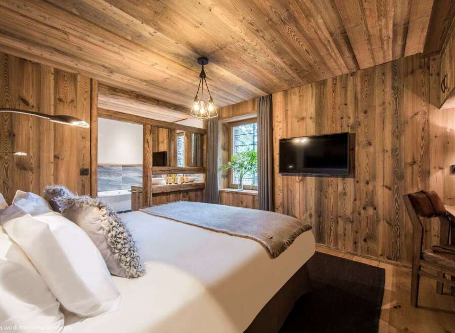 Experience rustic luxury in this stunning bedroom.