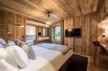 Experience rustic luxury in this stunning bedroom.