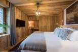 Experience rustic elegance in this stunning bedroom.
