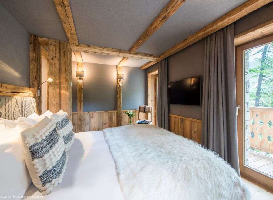 Experience rustic elegance in this cozy bedroom.