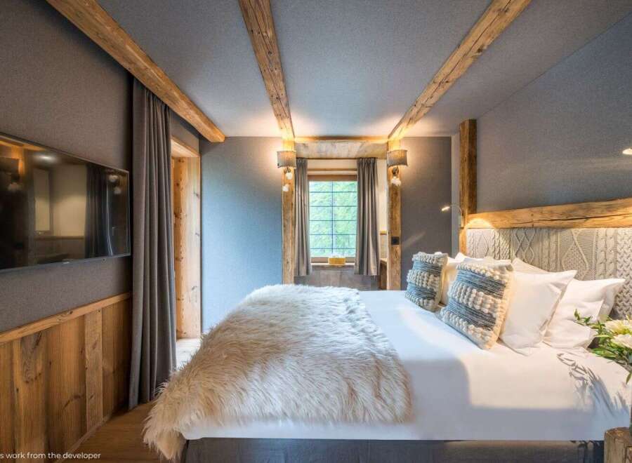 Experience rustic elegance in this cozy bedroom.