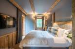 Experience rustic elegance in this cozy bedroom.