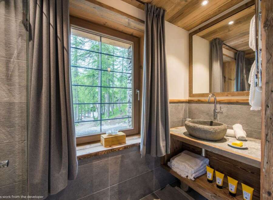 Experience rustic elegance in this stunning bathroom.