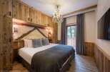 Experience rustic elegance in this stunning bedroom.