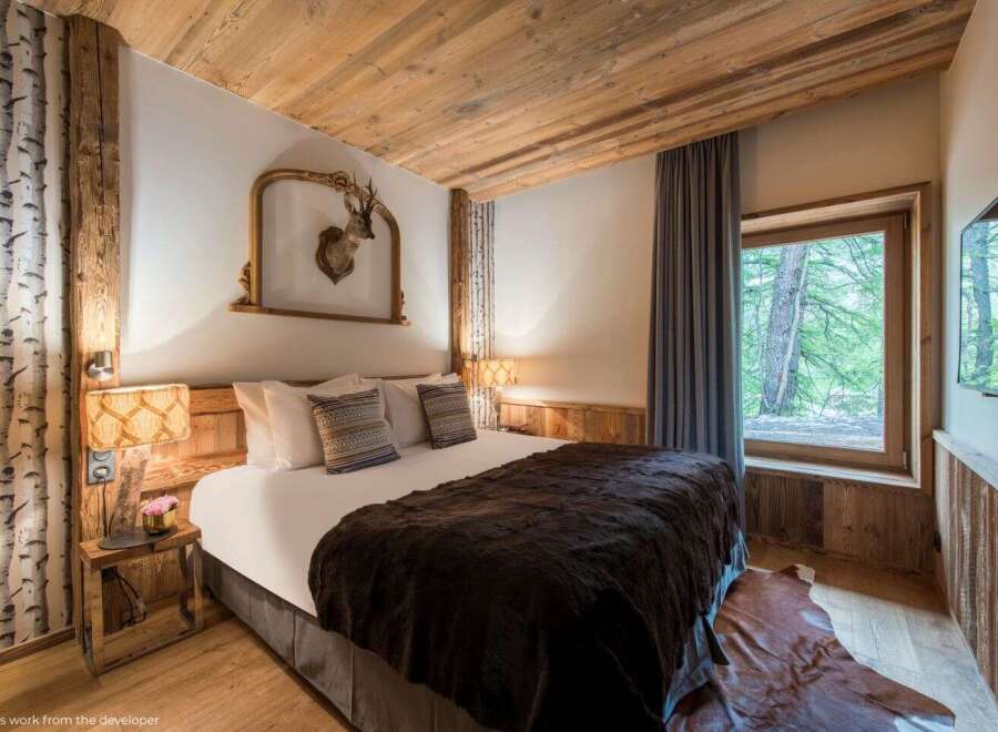 Experience rustic luxury in this stunning bedroom.