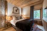 Experience rustic luxury in this stunning bedroom.