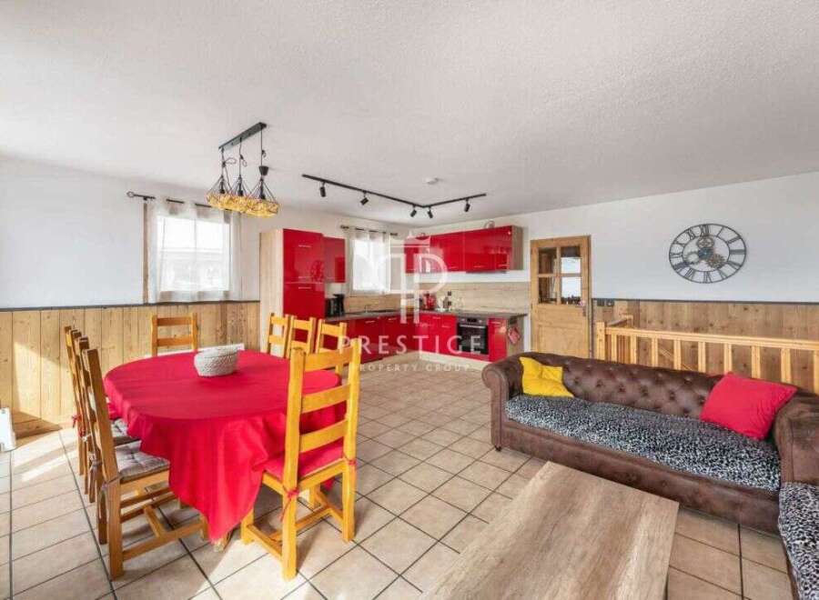 Discover this stunning property featuring a modern red kitchen, perfect for culinary enthusiasts.