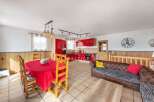 Discover this stunning property featuring a modern red kitchen, perfect for culinary enthusiasts.