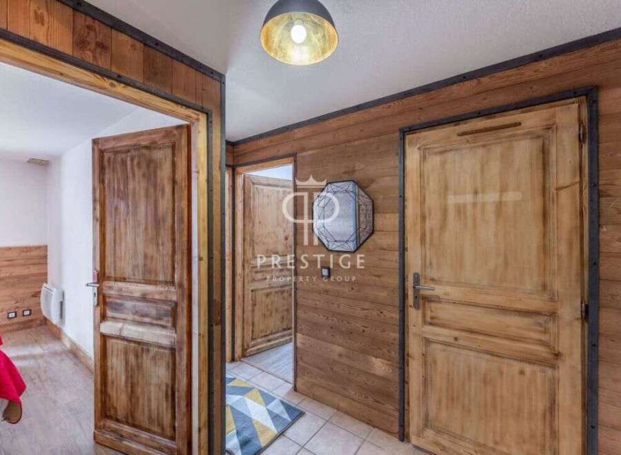 Discover the rustic charm of this property, featuring stunning wooden doors and walls that exude warmth and character.