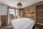 Discover a cozy bedroom with stunning mountain views.