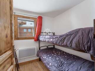 Cozy bedroom featuring bunk beds, perfect for accommodating guests or family.