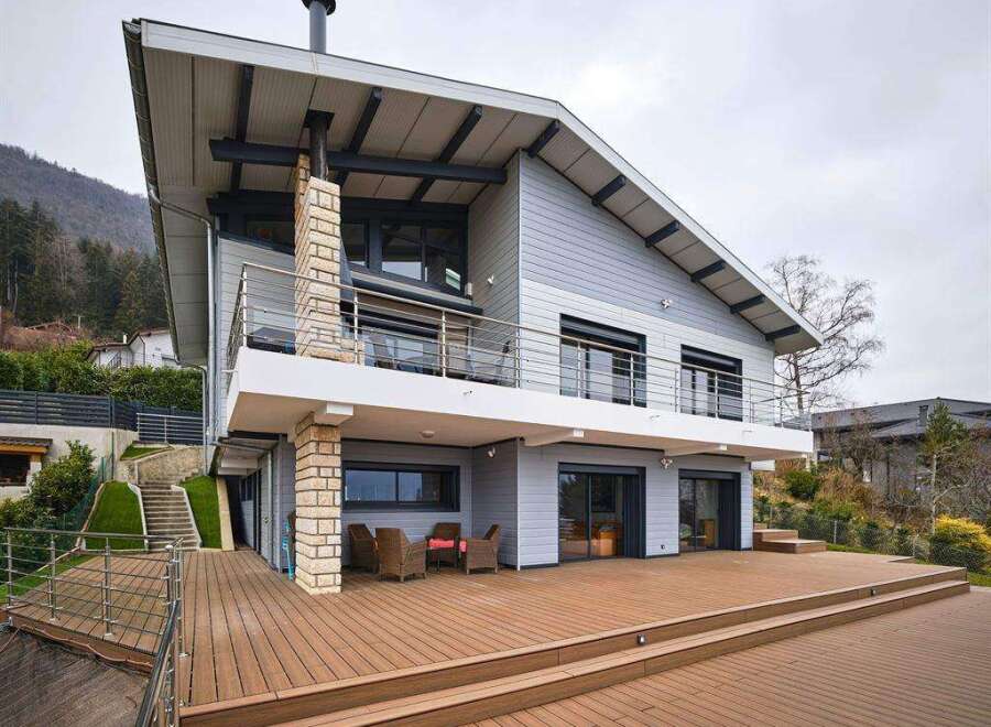Stunning modern home with expansive deck and mountain views.