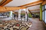 This stunning loft boasts exposed wooden beams, creating a warm and inviting atmosphere.