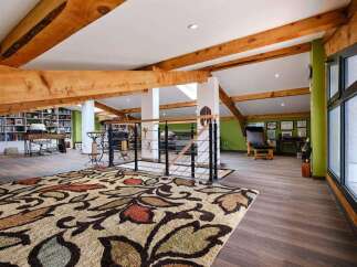 This stunning loft boasts exposed wooden beams, creating a warm and inviting atmosphere.